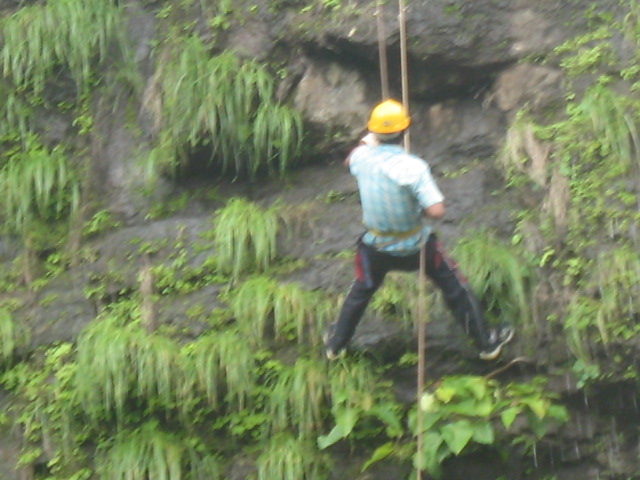 Rappelling down the waterfall